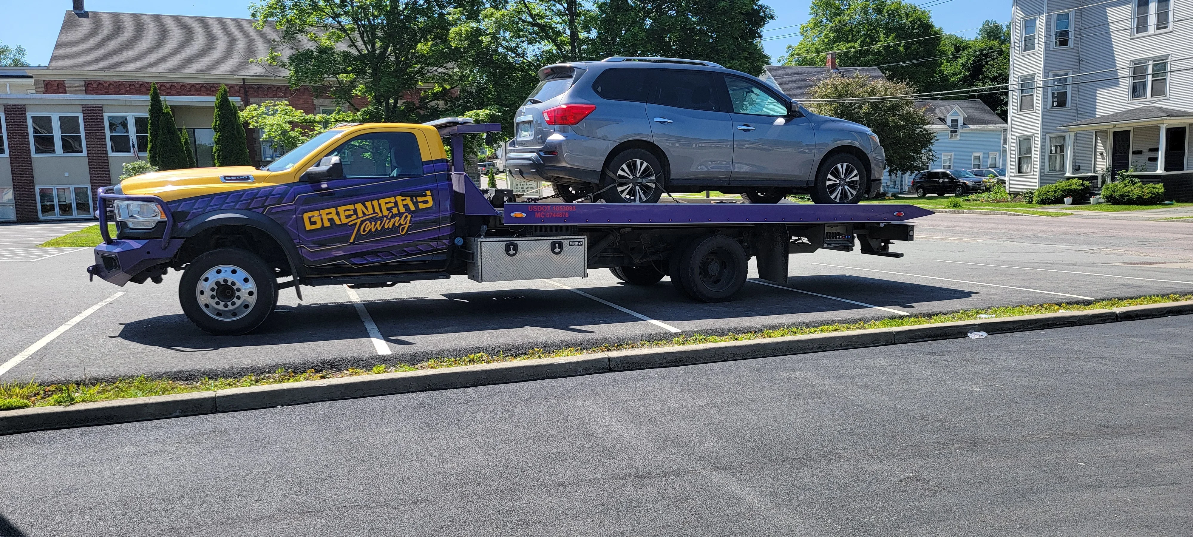 Flatbed Tow Truck Carrying SUV